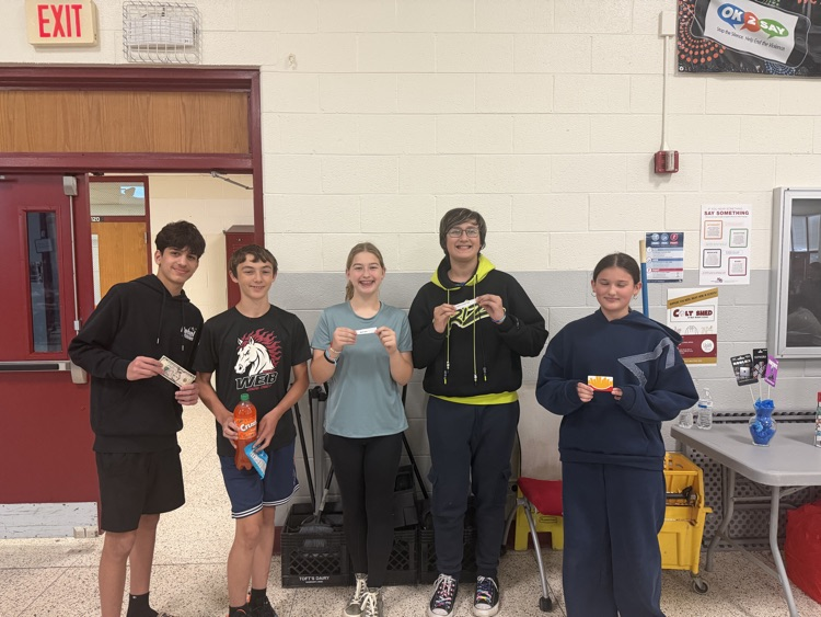 5 students stand for fundraising photo