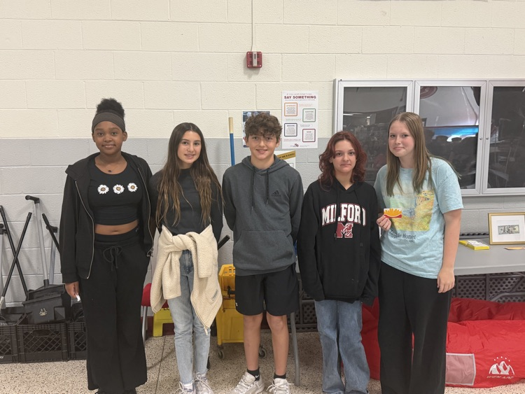 5 students stand for fundraising photo