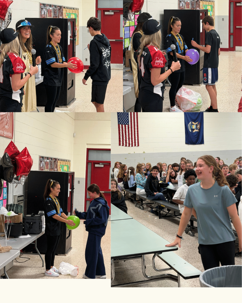 PTO Fundraiser Kickoff in the Cafeteria. Parents holding balloons for students to pop.