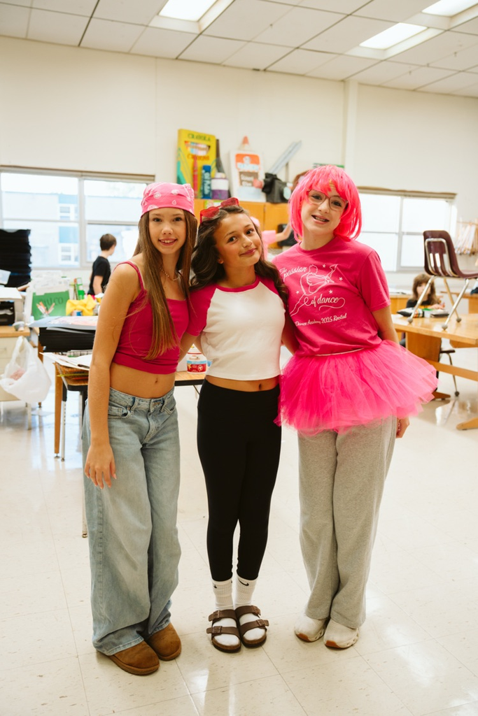 group photo of students in pink