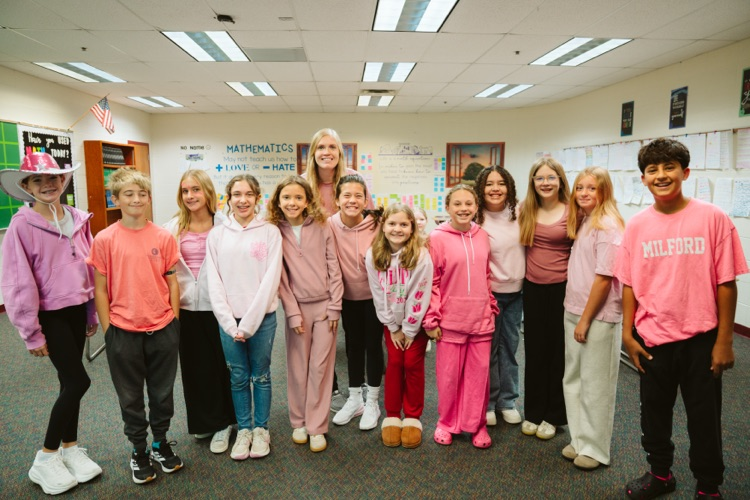 group photo of students in pink