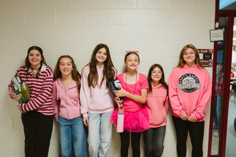 group photo of students in pink
