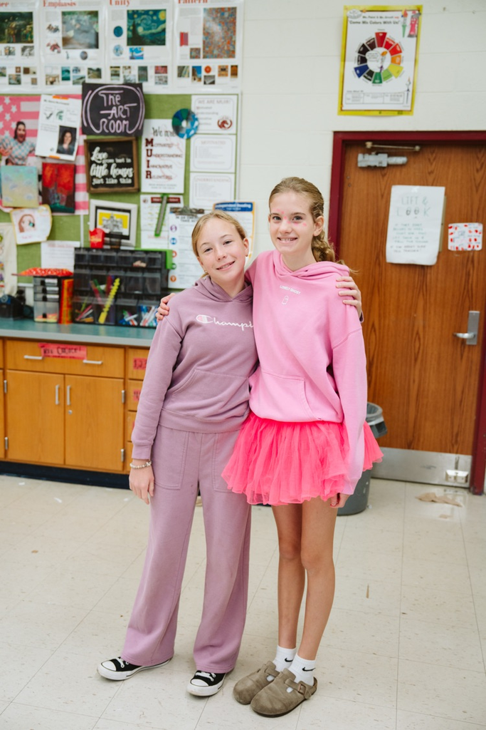 group photo of students in pink