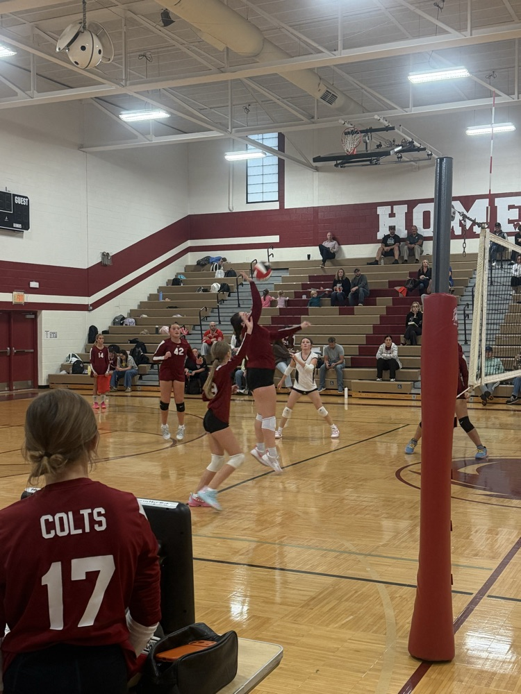 Muir volleyball player hits the ball