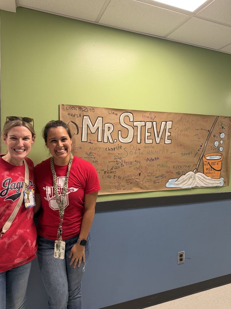 Teachers with a sign for custodians 