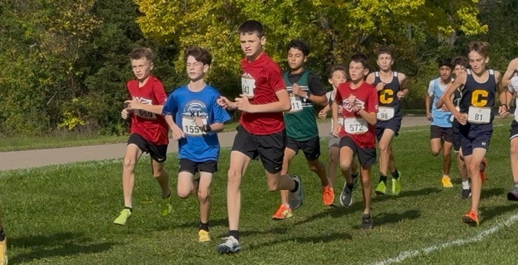 action shot of runners in various jerseys mid race
