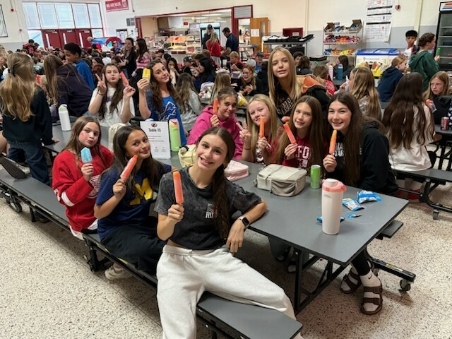 students eating popsicles in the cafeteria 