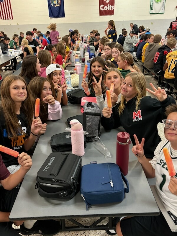 students eating popsicles in the cafeteria 