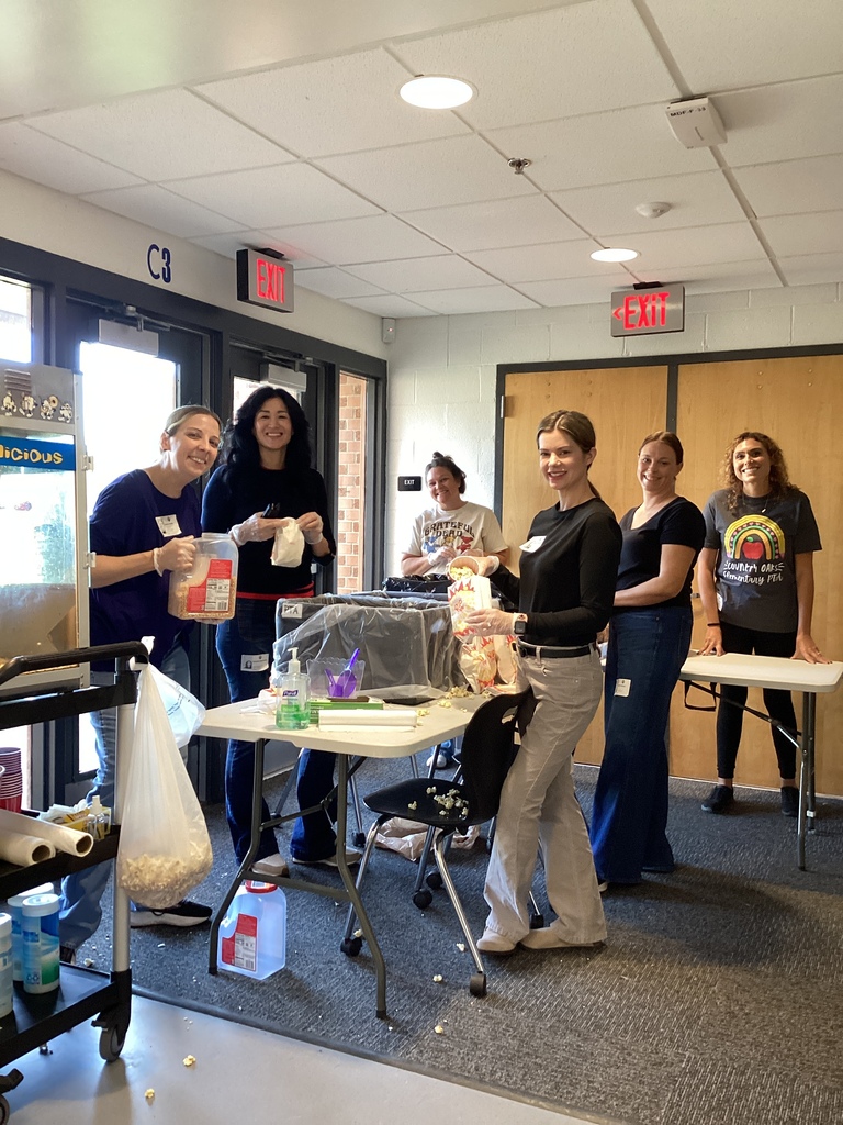PTA parents popping popcorn for the entire school! Happy Friday!