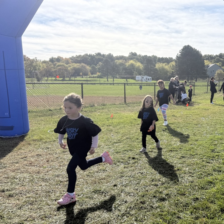 young student running outdoors