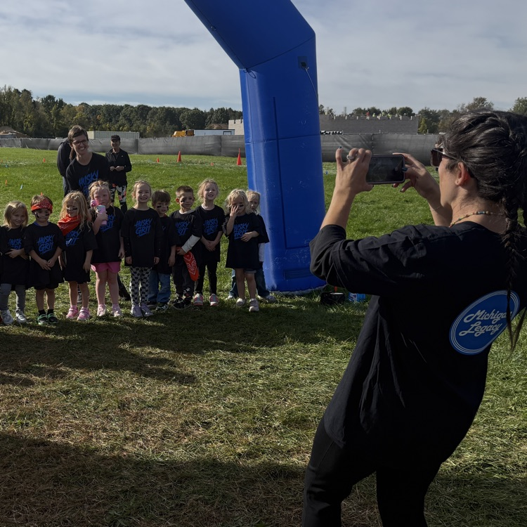 young students running outdoors