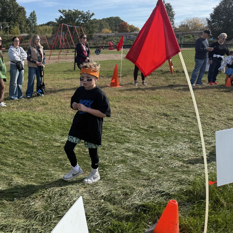 young student running outdoors