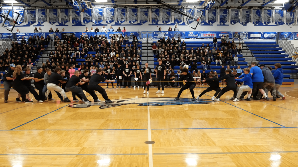 Several students in gym taking part in a tug o war... 
