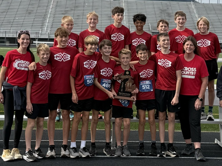 group photo of cross country runners on a track