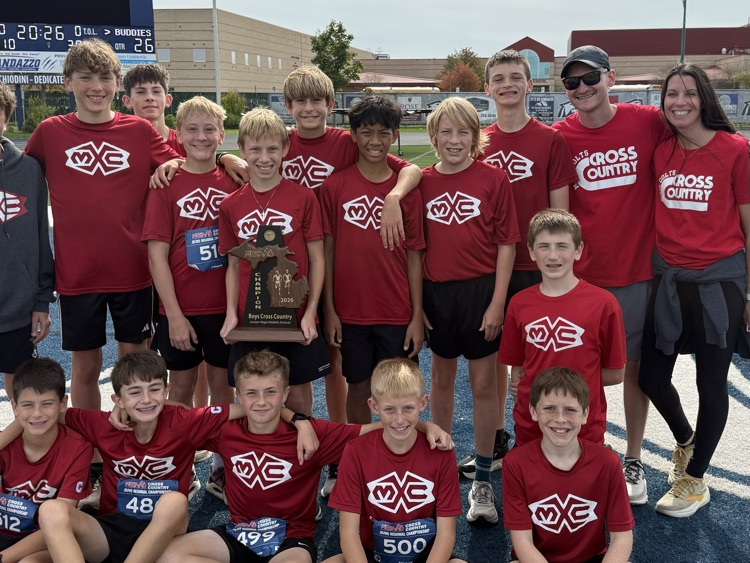 group photo of cross country runners on a track
