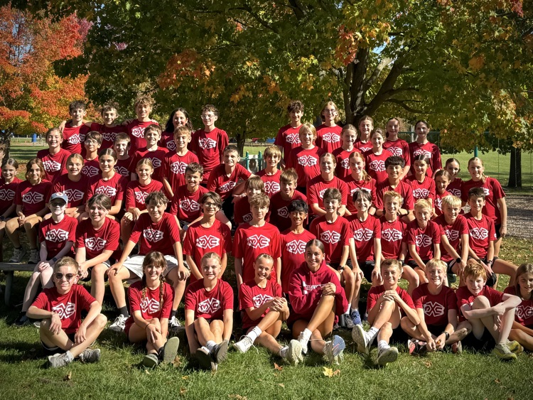 group photo of cross country team in red Muir