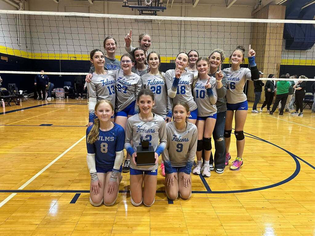 7th Grade Volleyball team with their award