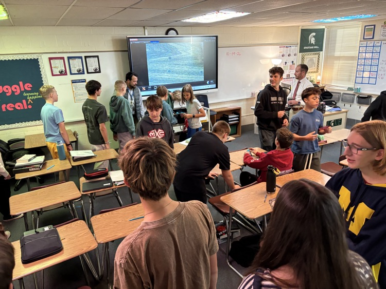 students move around a classroom 