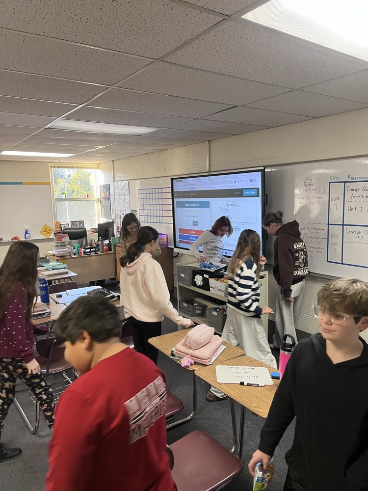 students move around a classroom