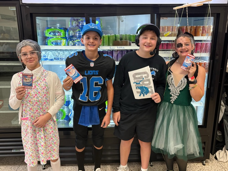 a group of students holding certificates in the costumes 