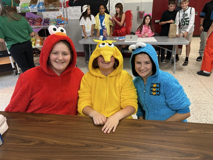 a group of students in Sesame Street monster costumes 