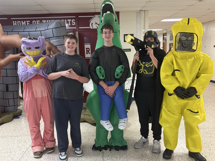a group of students stand for a photo in their costumes
