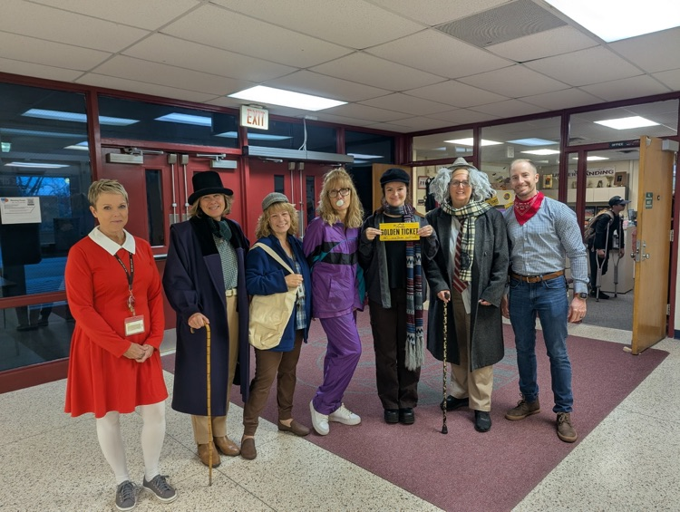 a group of teacher chaperones in their costumes at the Halloween party