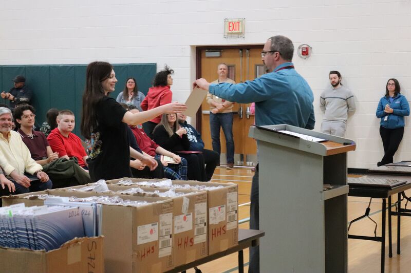 Student receives award from Mr. Dowker