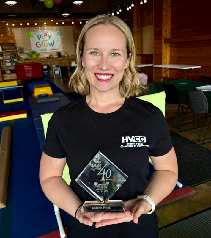 Melanie Plank, Class of 2005, with her award
