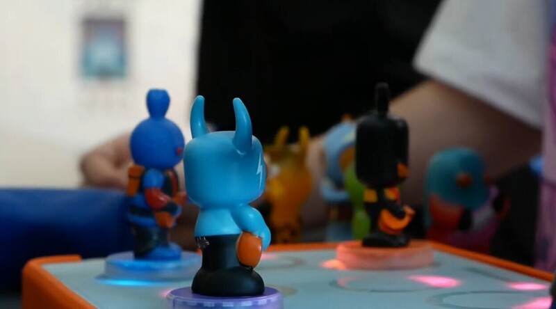Image of figures on a light up board that are used to create sound