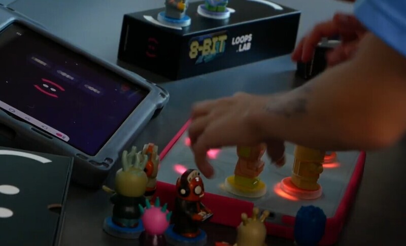 Image of figures on a light up board that are used to create sound