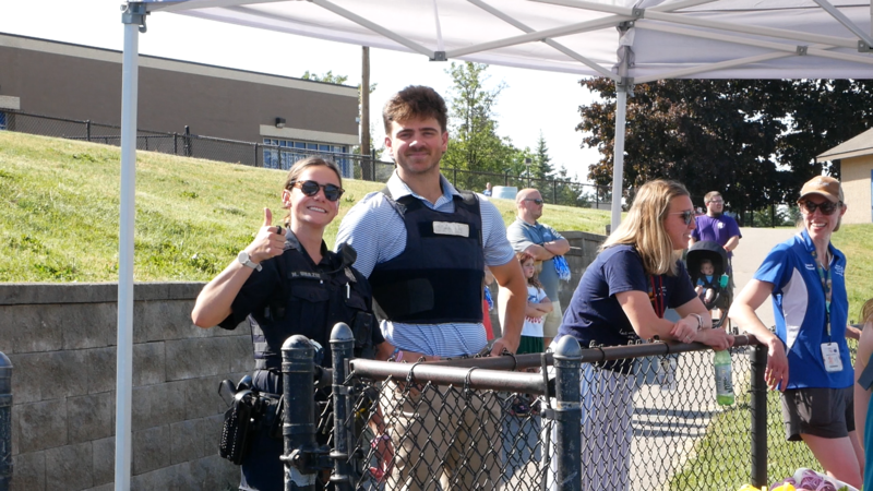 Police officer and others watching the event from the sidelines