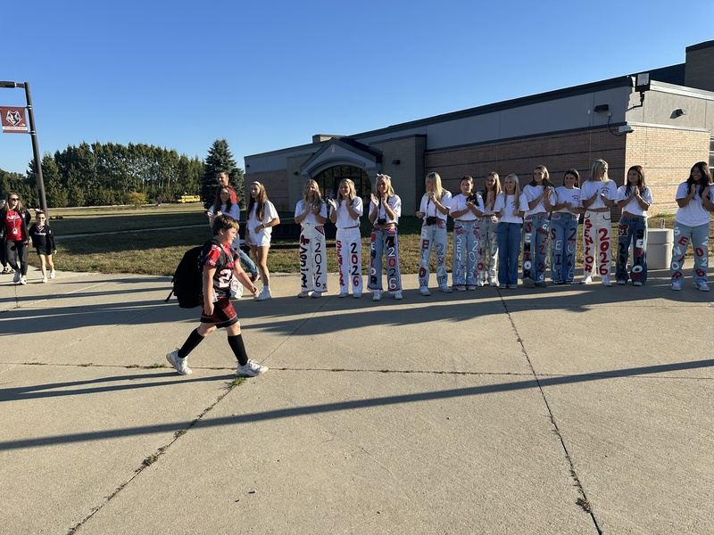 Heritage students being welcomed to school by Milford Students for Hoco2025