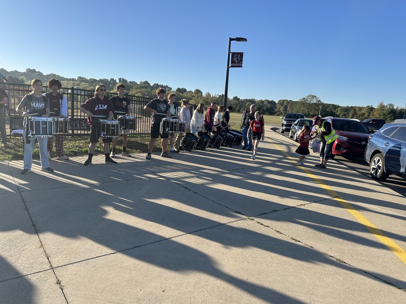 Heritage students being welcomed to school by Milford Students for Hoco2025