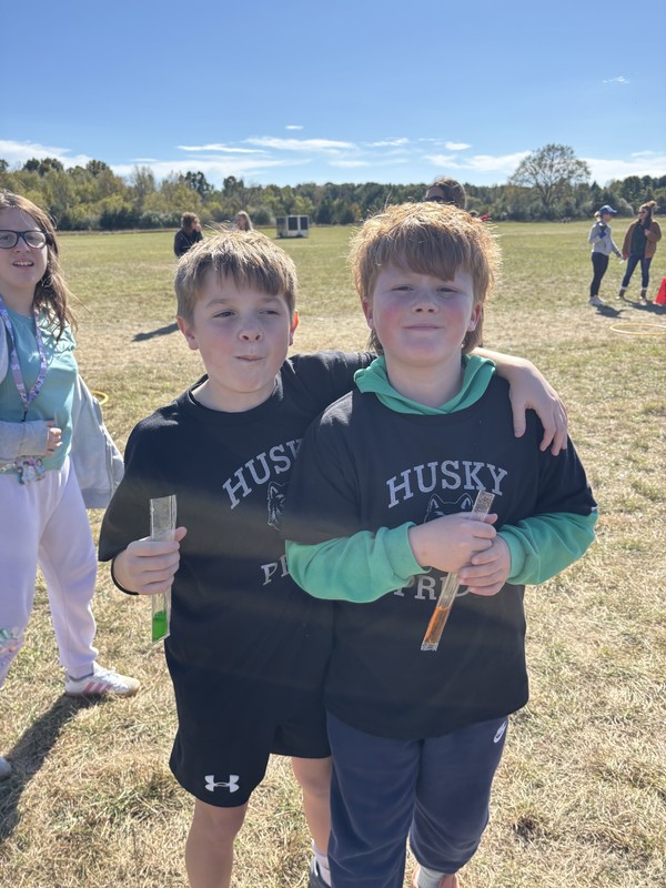 Students running in Fun run and posing.