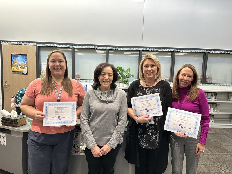 Jennifer Hollander and Jenna Stevens posing with Grant winners at Heritage