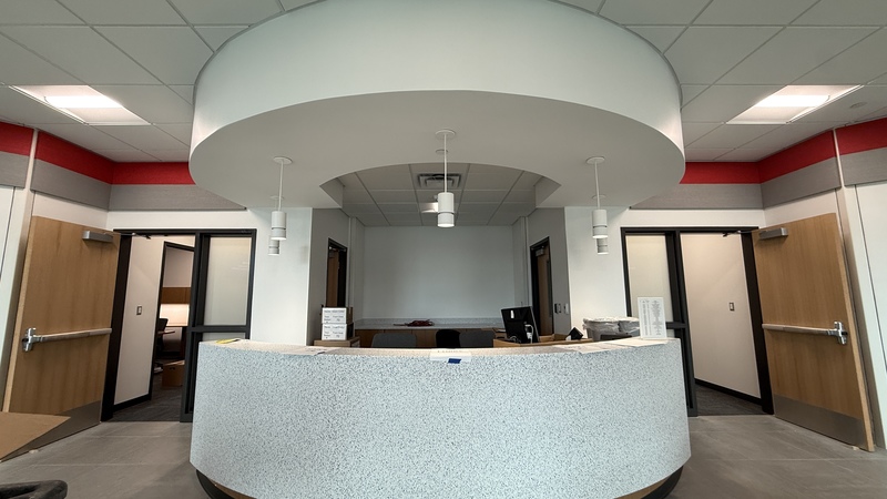 photo of main desk in lobby at new center