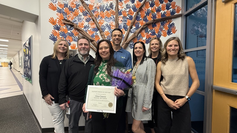 Group photo of HVS support person of the year Gina Ciancio and other HVS staff 