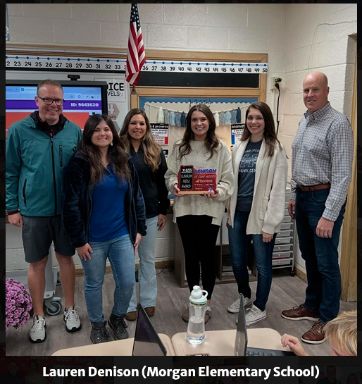 Ad Astra Radio representatives Aaron Napier, Brenna Eller, Jessica Shank, October Classroom Hero Lauren Denison, Heartland Credit Union Avenue A Branch Manager Marilyn Fisk, and Midway Motors General Manager Brian Bobo (Photo by MES Principal Brad Binns)