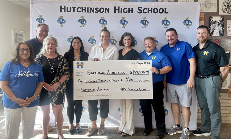 staff with giant check