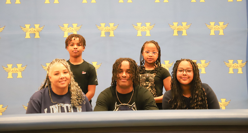Gaitho-Karanu poses with his family after signing his letter of intent.