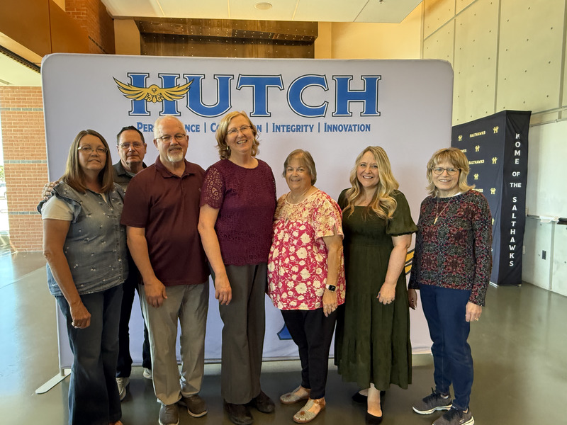 people standing in front of a backdrop