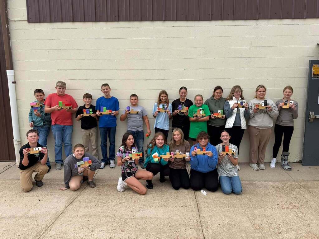 Junior High Ag. has been busy learning to work with some of the machines in the shop.  The past week they have been using the bandsaw, miter saw, table saw, drills and sanders.   The best part of Friday was watching the kids line up to take the picture! 