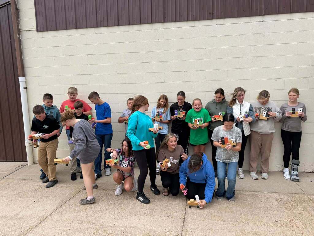 Junior High Ag. has been busy learning to work with some of the machines in the shop.  The past week they have been using the bandsaw, miter saw, table saw, drills and sanders.   The best part of Friday was watching the kids line up to take the picture! 