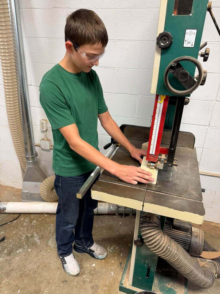 Junior High Ag. has been busy learning to work with some of the machines in the shop.  The past week they have been using the bandsaw, miter saw, table saw, drills and sanders.   The best part of Friday was watching the kids line up to take the picture! 