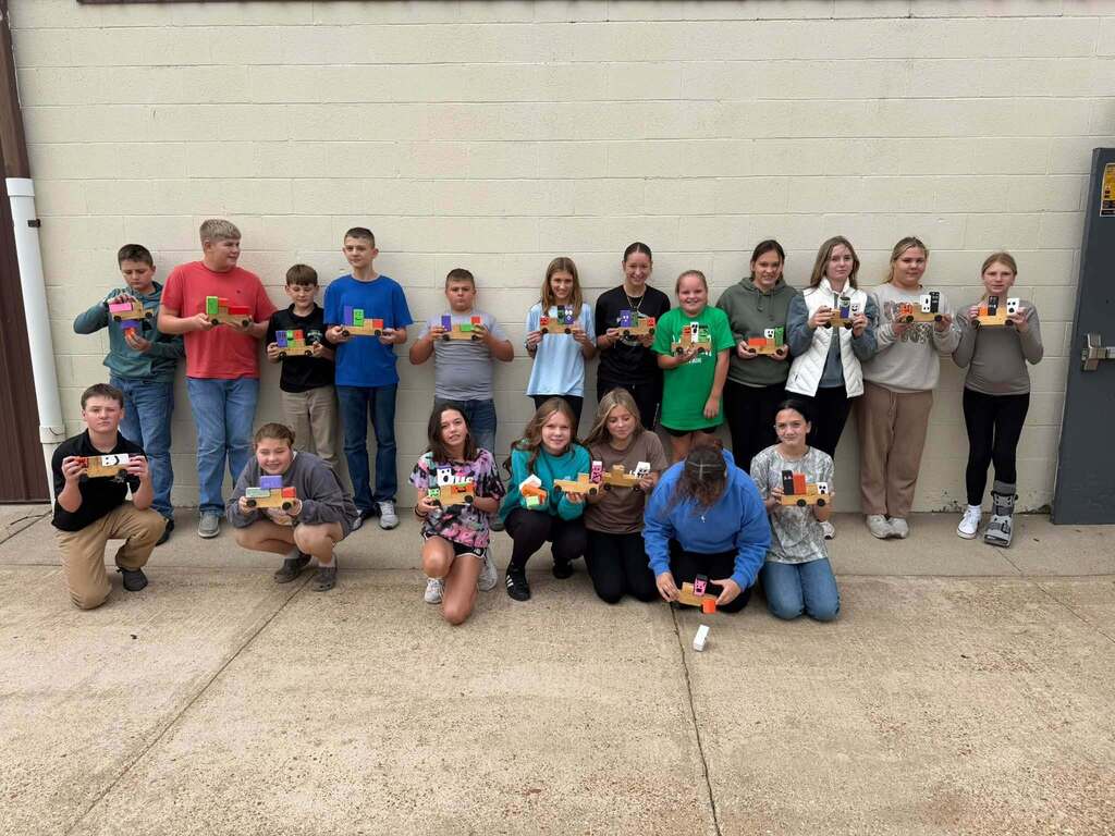 Junior High Ag. has been busy learning to work with some of the machines in the shop.  The past week they have been using the bandsaw, miter saw, table saw, drills and sanders.   The best part of Friday was watching the kids line up to take the picture! 