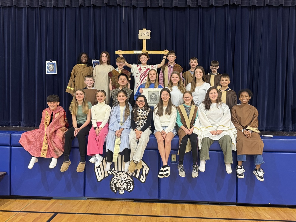 kids with a cross living stations