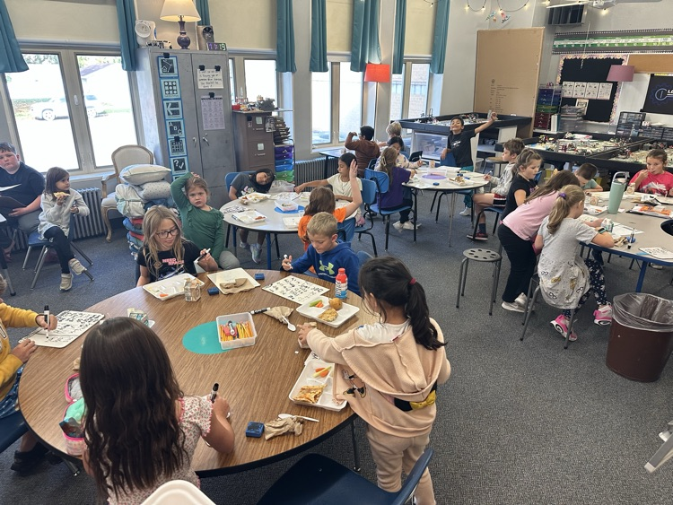 kids eating and writing