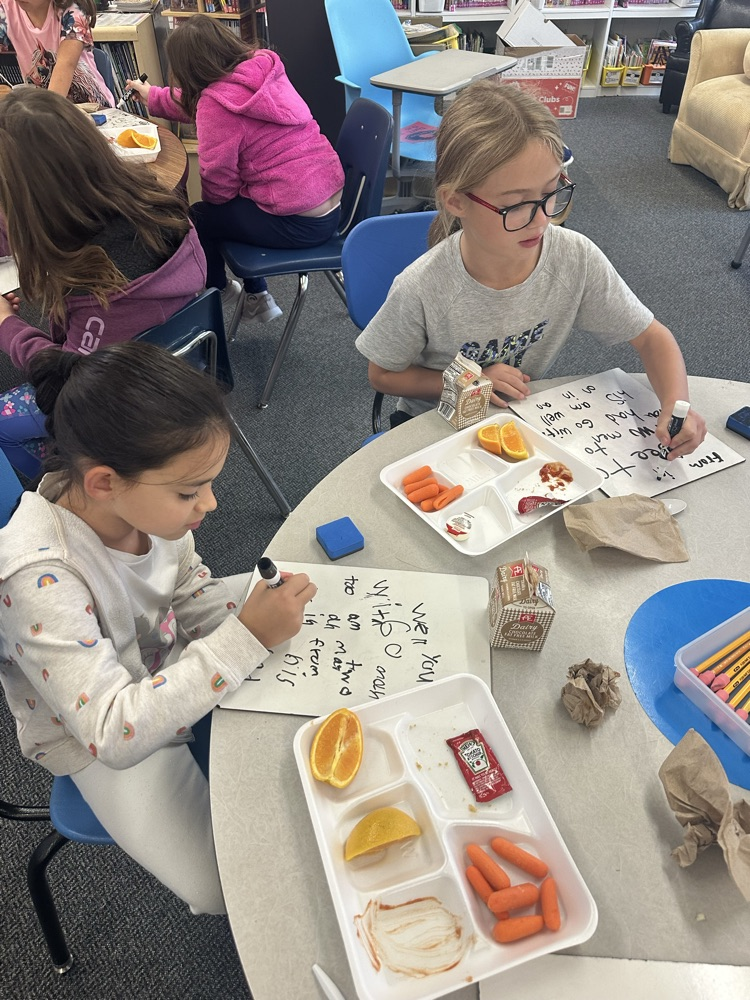 kids eating and writing
