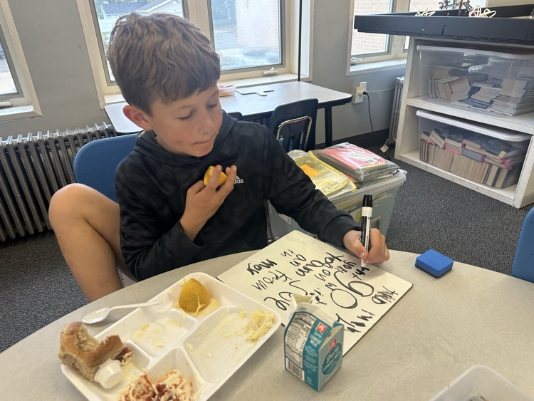 kids eating and writing